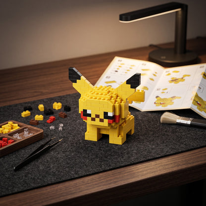 Pikachu micro brick kit shown in hand for scale, Adult Money